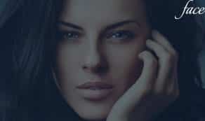 extreme close up of woman's face with provocative expression and resting head on hand