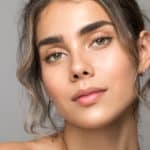 Close up studio shot of a beautiful woman with perfect skin