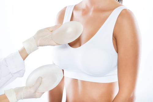 Portrait,Of,Female,Doctor,Choosing,Mammary,Prosthesis,With,Her,Patient